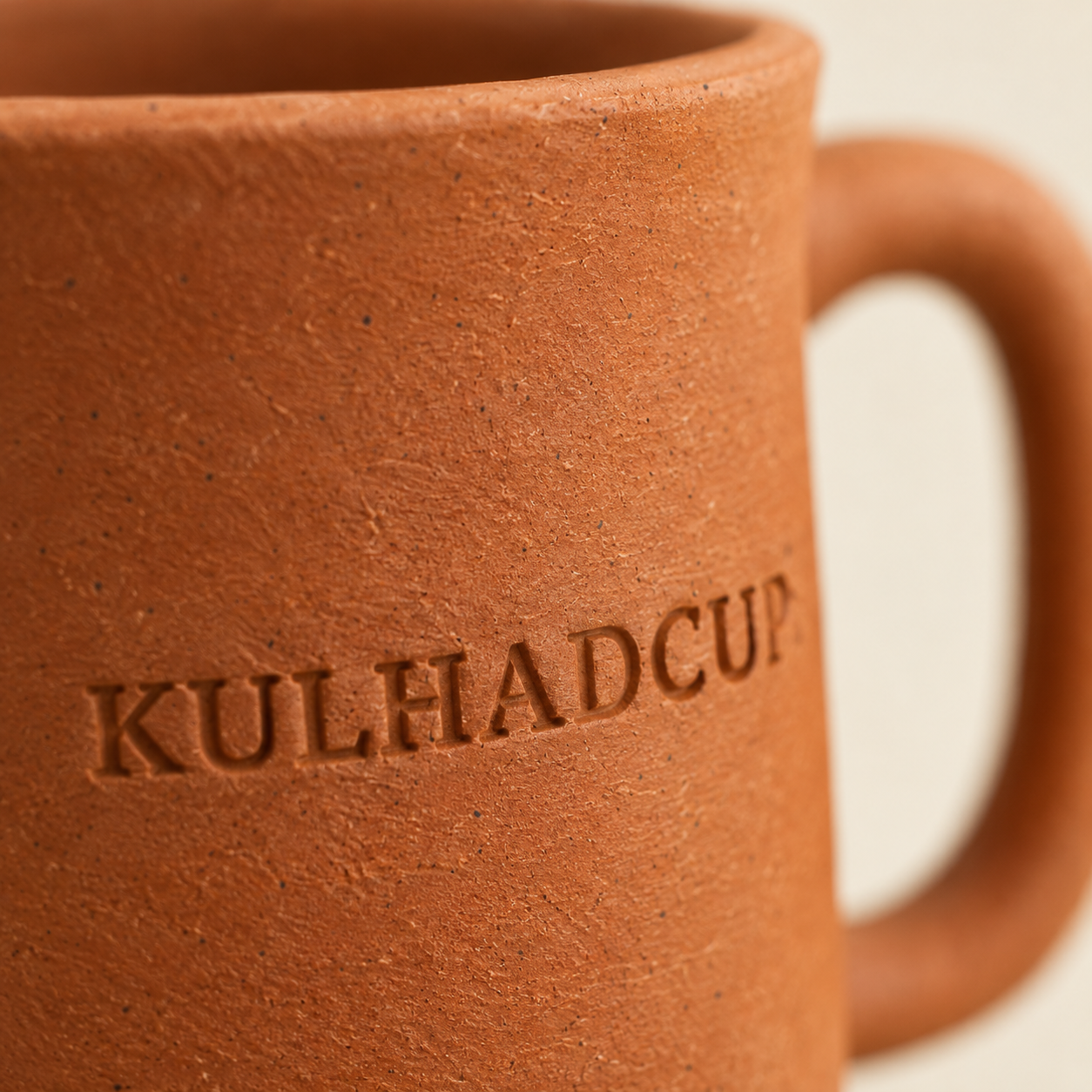 Macro view of engraving on kulhad mug with handle