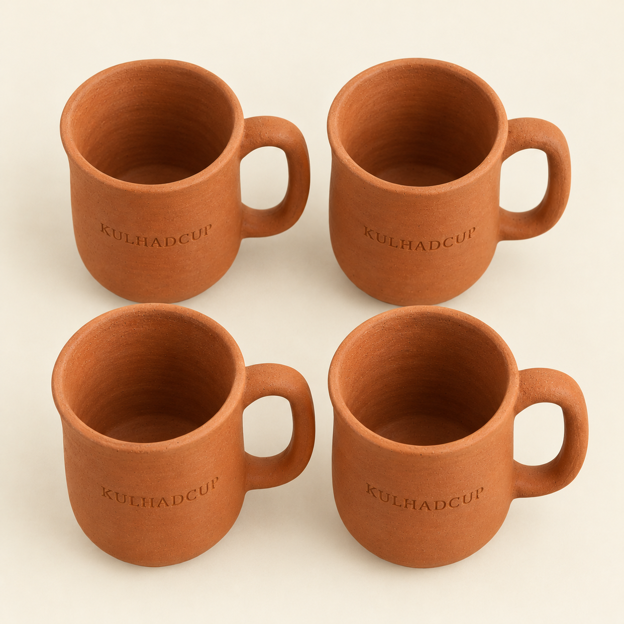 Top view of four terracotta kulhad mugs with handle